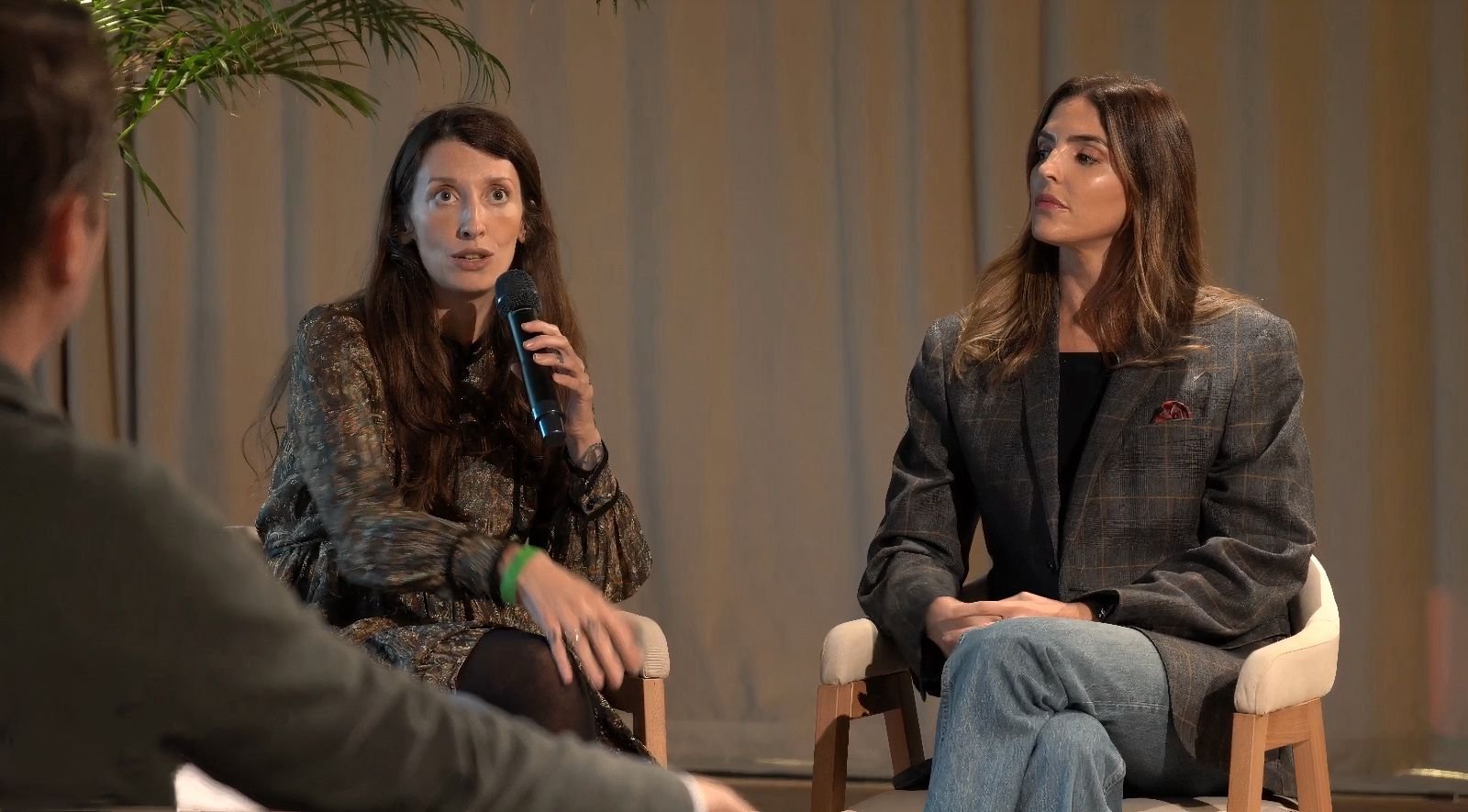 Two speakers during a panel discussion