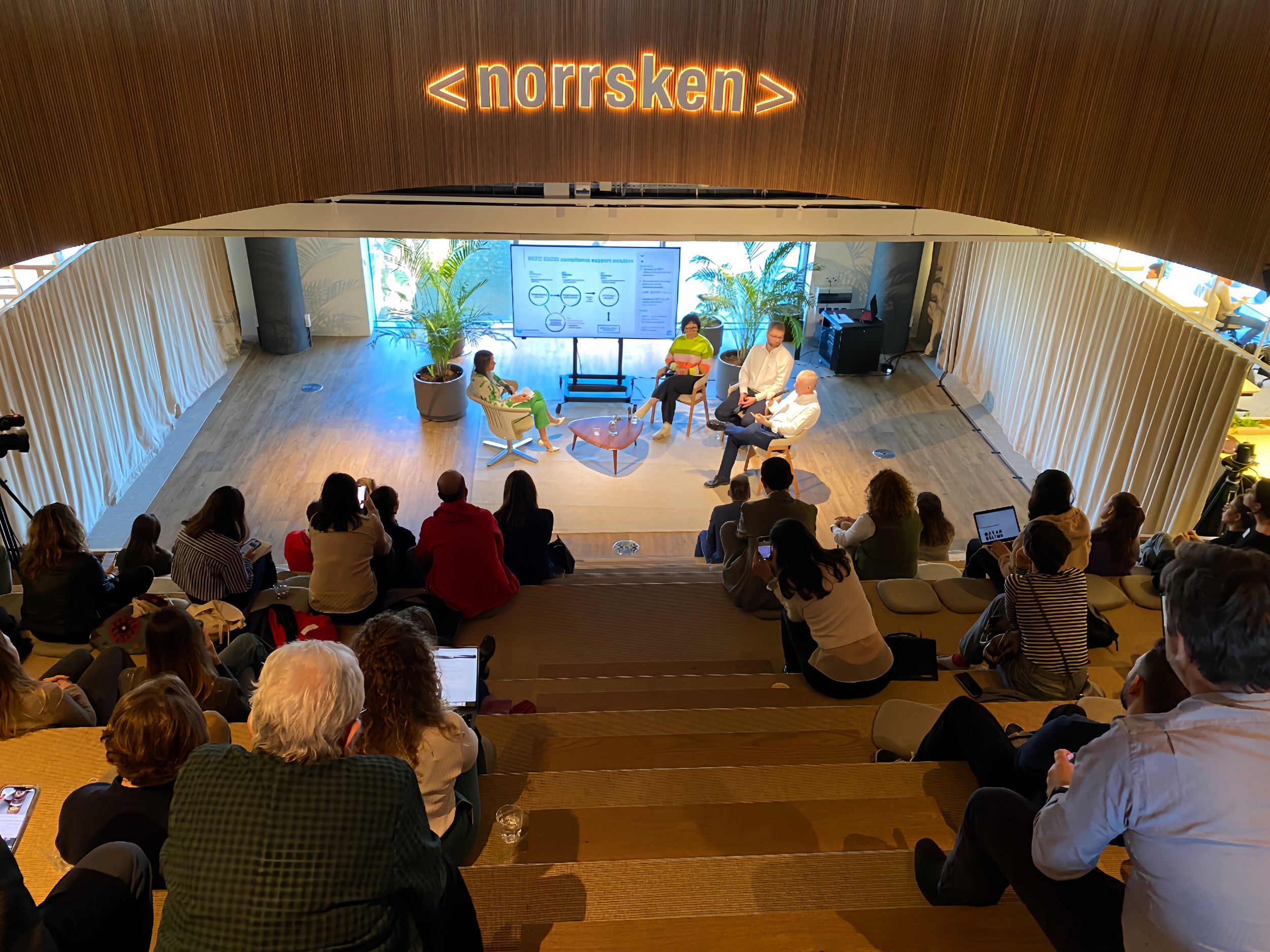 Diverse audience watching an ECOSYSTEM Summit session