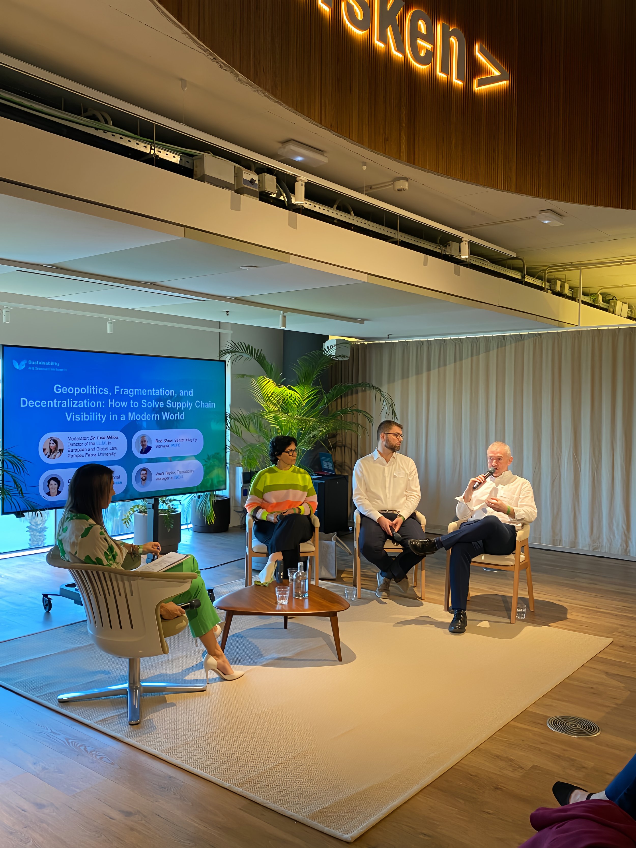 Panel conversation beneath the Norrsken sign